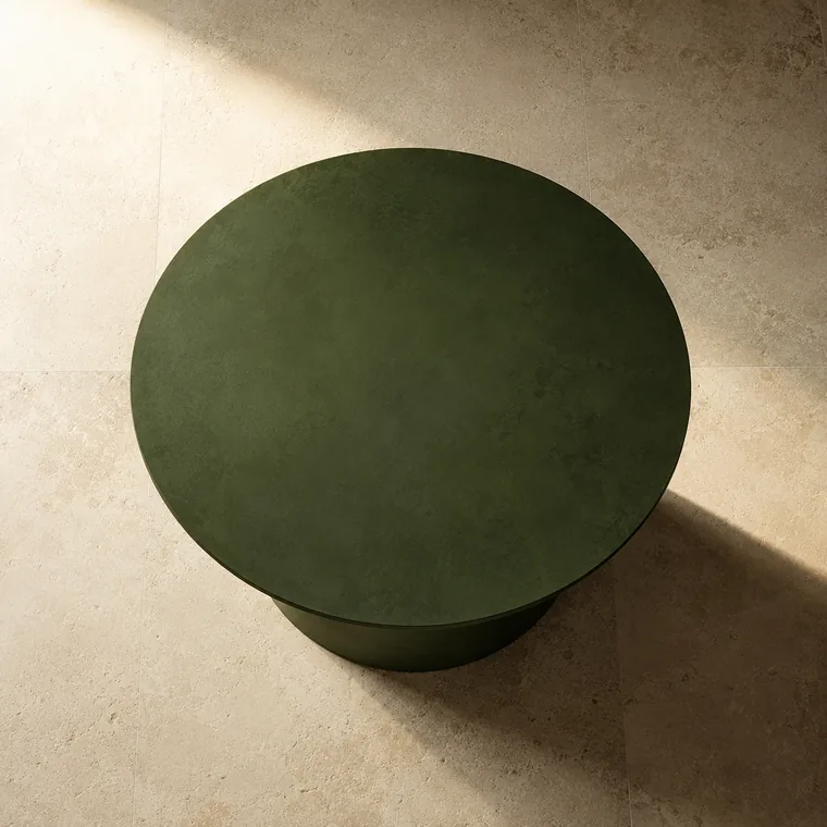 Deep green circular form in soft natural light, representing team alignment.